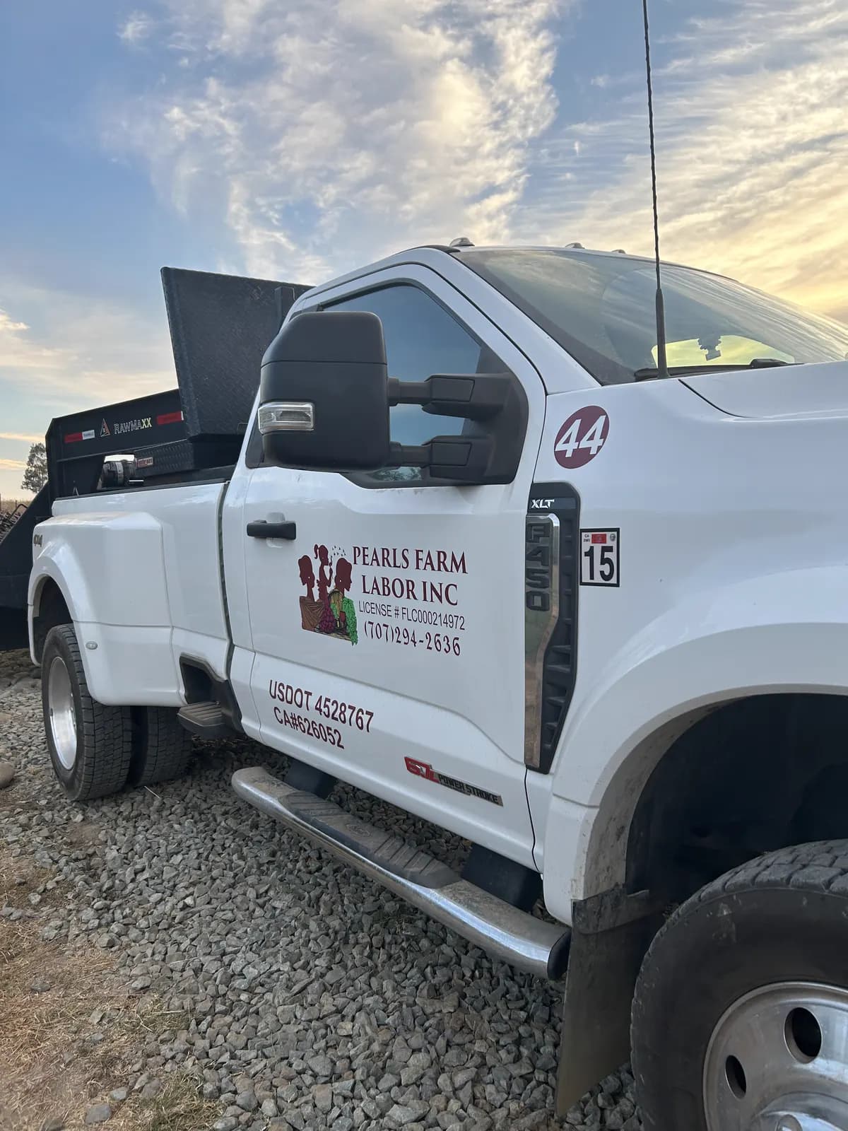 Branded Pearls Farm Labor truck at an agricultural property