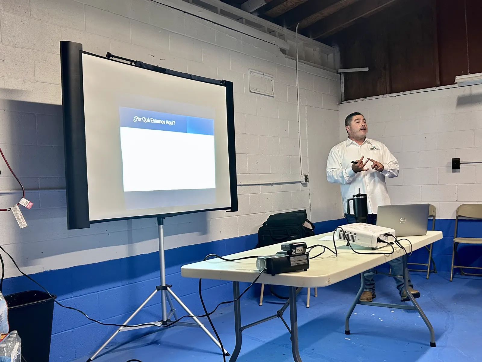 Instructor leading a Spanish-language agricultural safety presentation