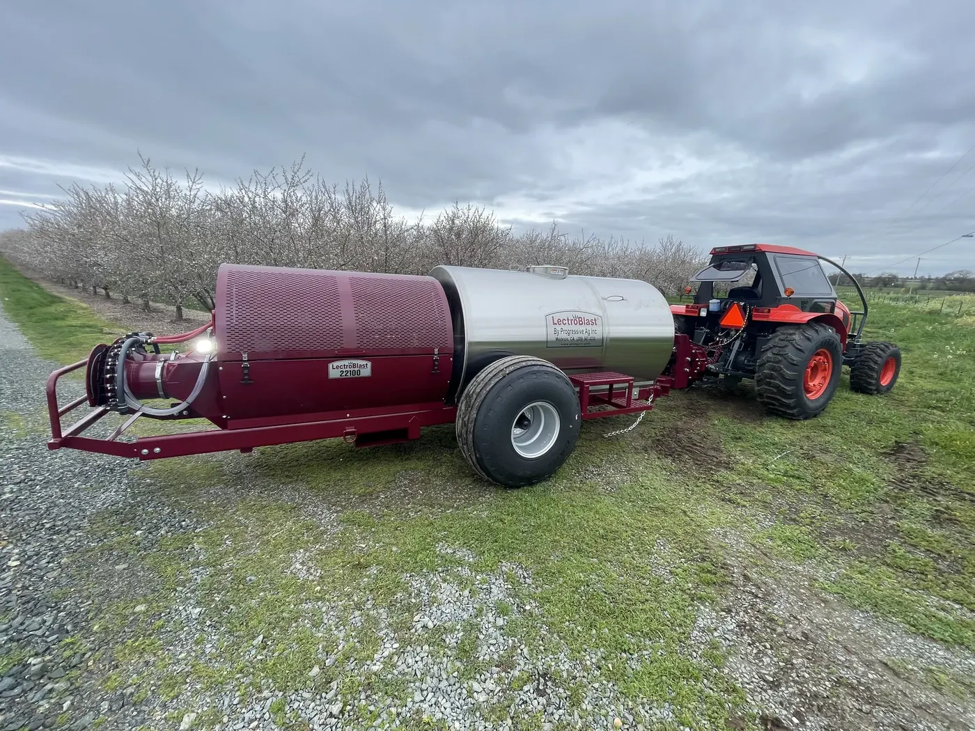 Air-blast application rig staged in an orchard